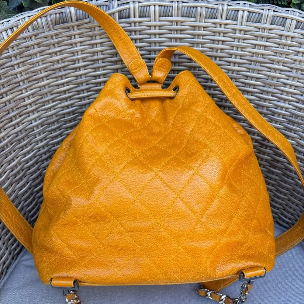 Authentic CHANEL Mustard caviar leather quilted drawstring backpack